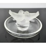A Lalique glass dish, modelled with love birds, signed to the base, Lalique, France, 10cm diameter.