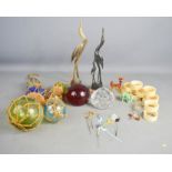 A group of glass animals, glass cocktail stick, paperweights, napkin rings etc.