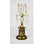 A Victorian candlestick with cut glass drops, and ble glass body hand painted with gilt figural