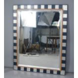 Two modern large wall mirrors, one painted gold, the other in blue and silver.