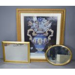 A large gilt framed picture and two wall mirrors.