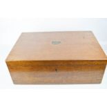 A 19th century mahogany box, with brass shield plaque to the top.