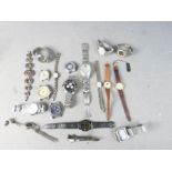 A group of wristwatches, including Timex, Avia, Lorus and others.