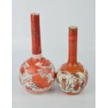 A pair of Japanese bottle vases, painted with figures and birds.