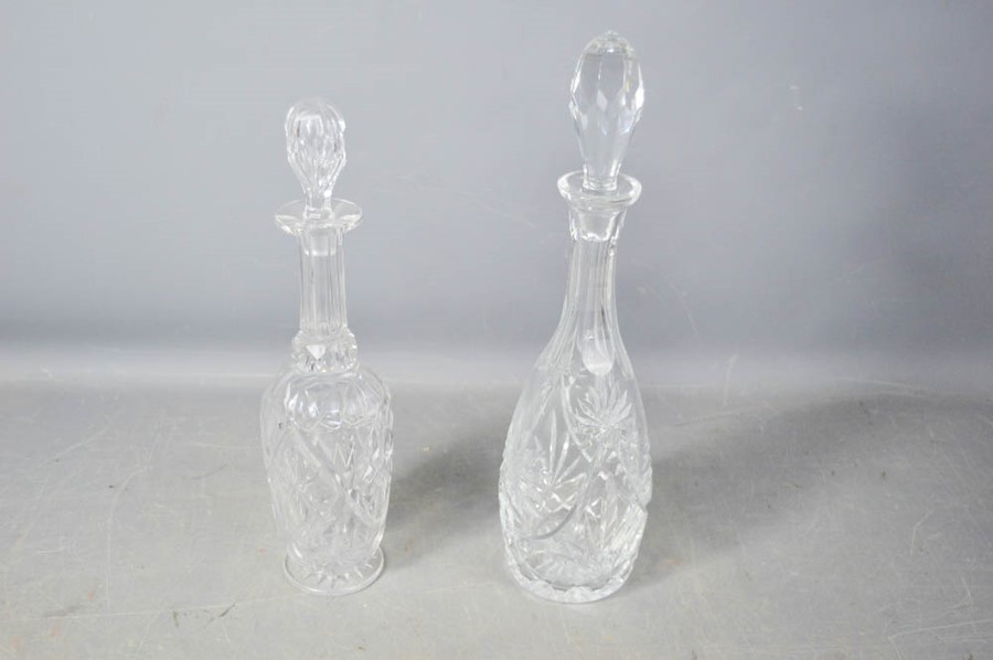 Two cut crystal decanters, 39cm high.