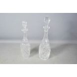Two cut crystal decanters, 39cm high.