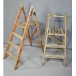 Two small antique step ladders.