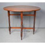 A late Victorian mahogany folding supper table, 19th century, 85 by 67cm.