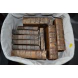 Ten antique leather bound books.