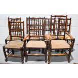 A set of 19th century bobbin turned dining chairs, six and two carvers, rush seats.