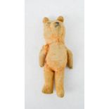 A small antique teddy bear, 16cm high.