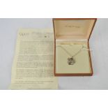A boxed Clogau gold / silver necklace with gold and diamond pendant (with certificate).