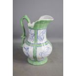 A large pottery jug with green ground.