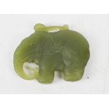 A Chinese natural Heitian jade hand carved double sided elephant pendant.