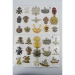 A group of British military cap badges. (30)