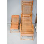 Three hand made Japanese wooden deck chairs.