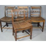 Four antique oak chairs.
