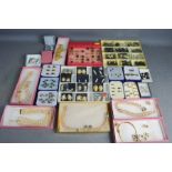 A quantity of costume jewellery, including novelty fashion rings, earrings in presentation cases and