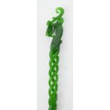 A vintage Chinese Heitian green jade hair pin, with carved phoenix surmount, and spiral stem.