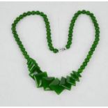 A Chinese Heitian green jade carved necklace.