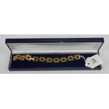 An 18ct rolled gold chain link bracelet. 19cm long