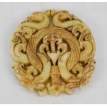 A Chinese jade double sided dragon carved pendant.