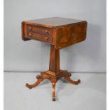 A 19th century rosewood work table with drop leaves and two drawers.