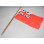 A vintage Great Britain flag on pole.