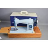 A sewing machine in case.