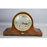 A 1930s mantle clock, with Roman numeral dial.