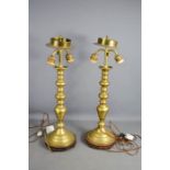 A pair of Edwardian brass dual light table lamps, with telescopic bases, 55cm high closed.