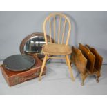 An ercol kitchen chair, magazine rack, oval mirror, and a lazy susan.