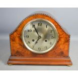 A 1930s burr wood mantle clock with arabic dial.