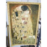 A wall hanging of Gustav Klimt.