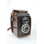 A Lomo Lubitel 2 twin lens camera and case.