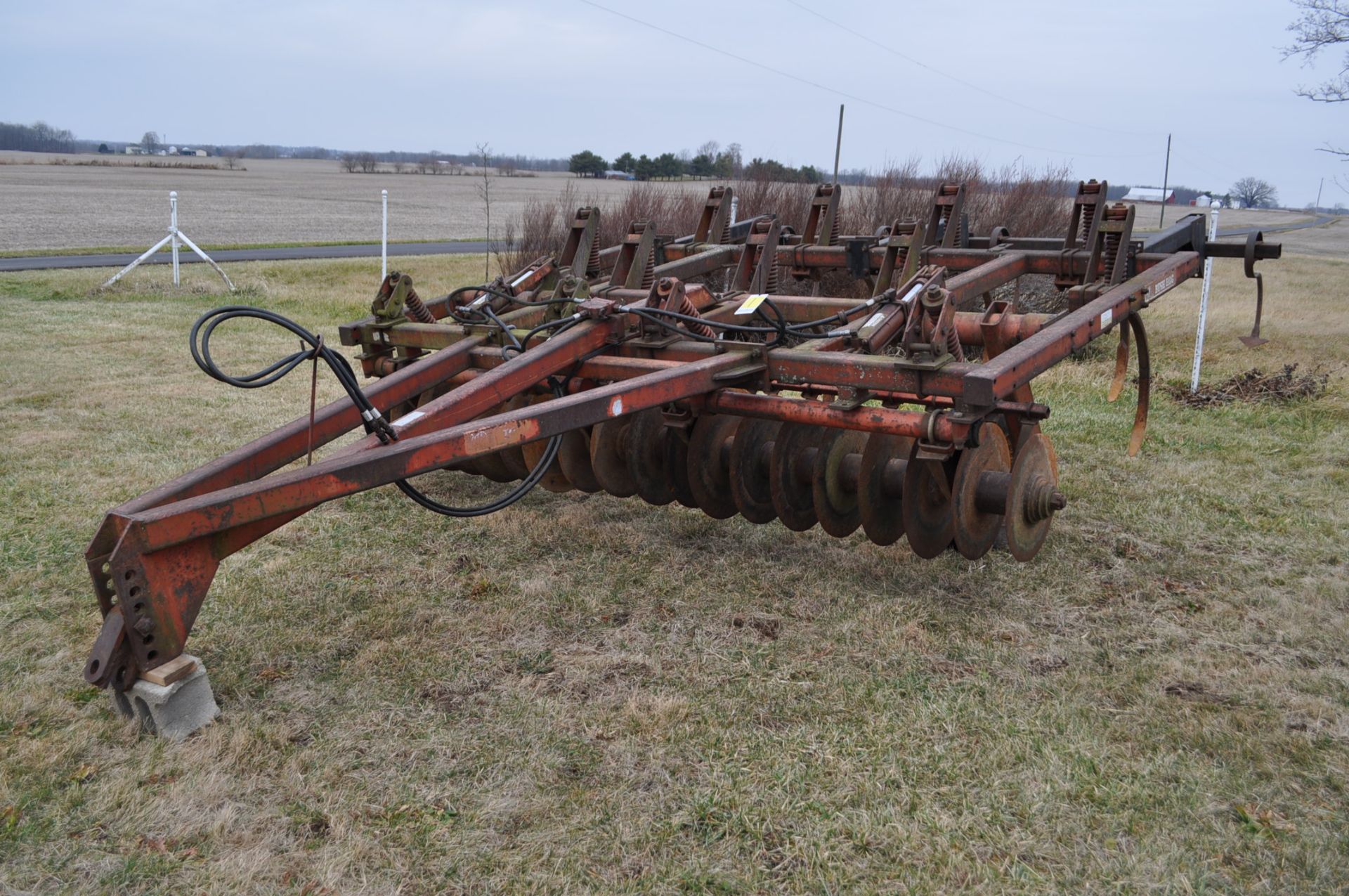 9 shank Brush Hog disc chisel, spring cushion front discs, rear leveler, hyd raise, pull type