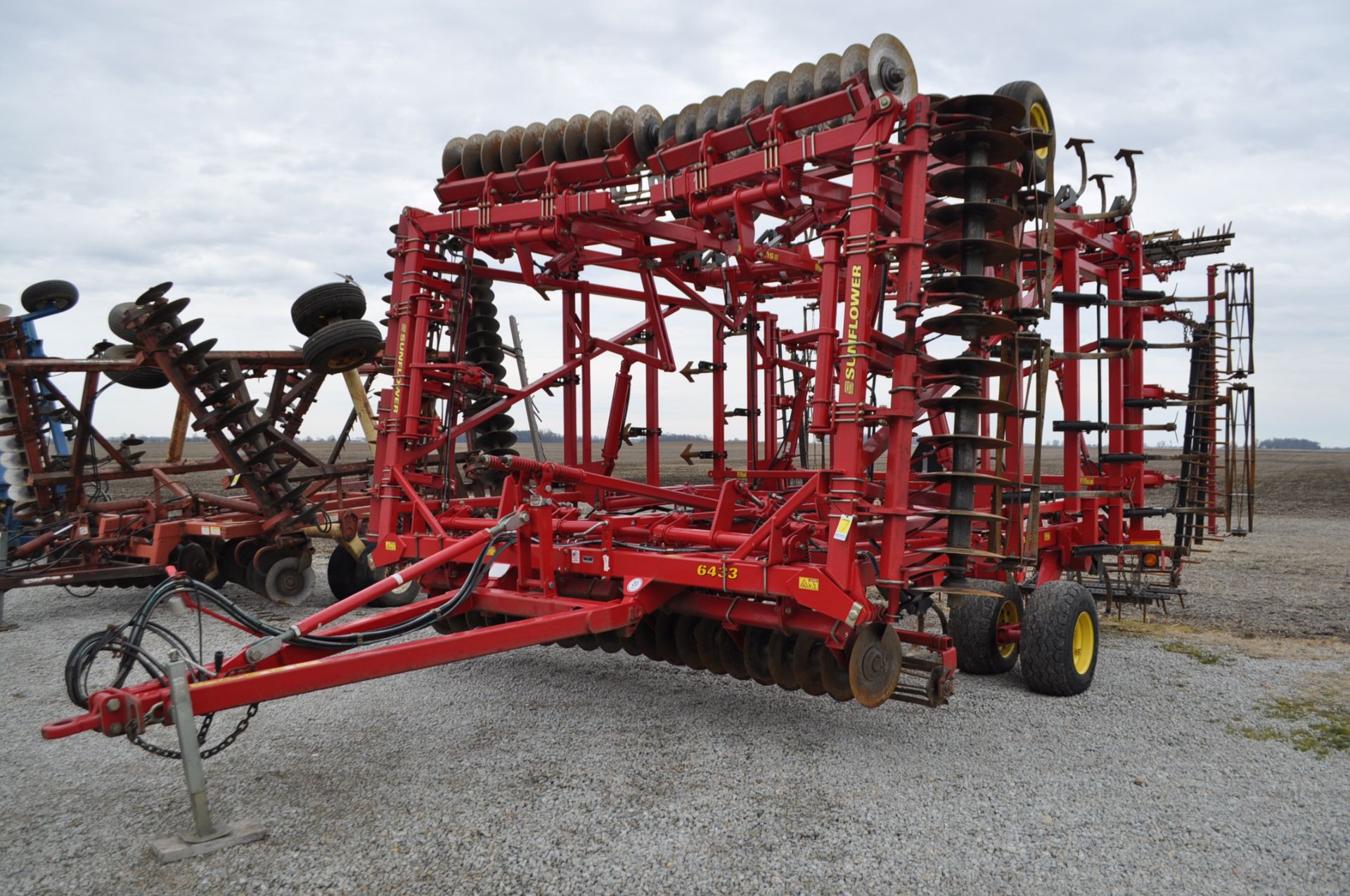 43’ Sunflower 6433 soil finisher, discs, rolling baskets, sweeps, 3-bar harrow, rear rolling