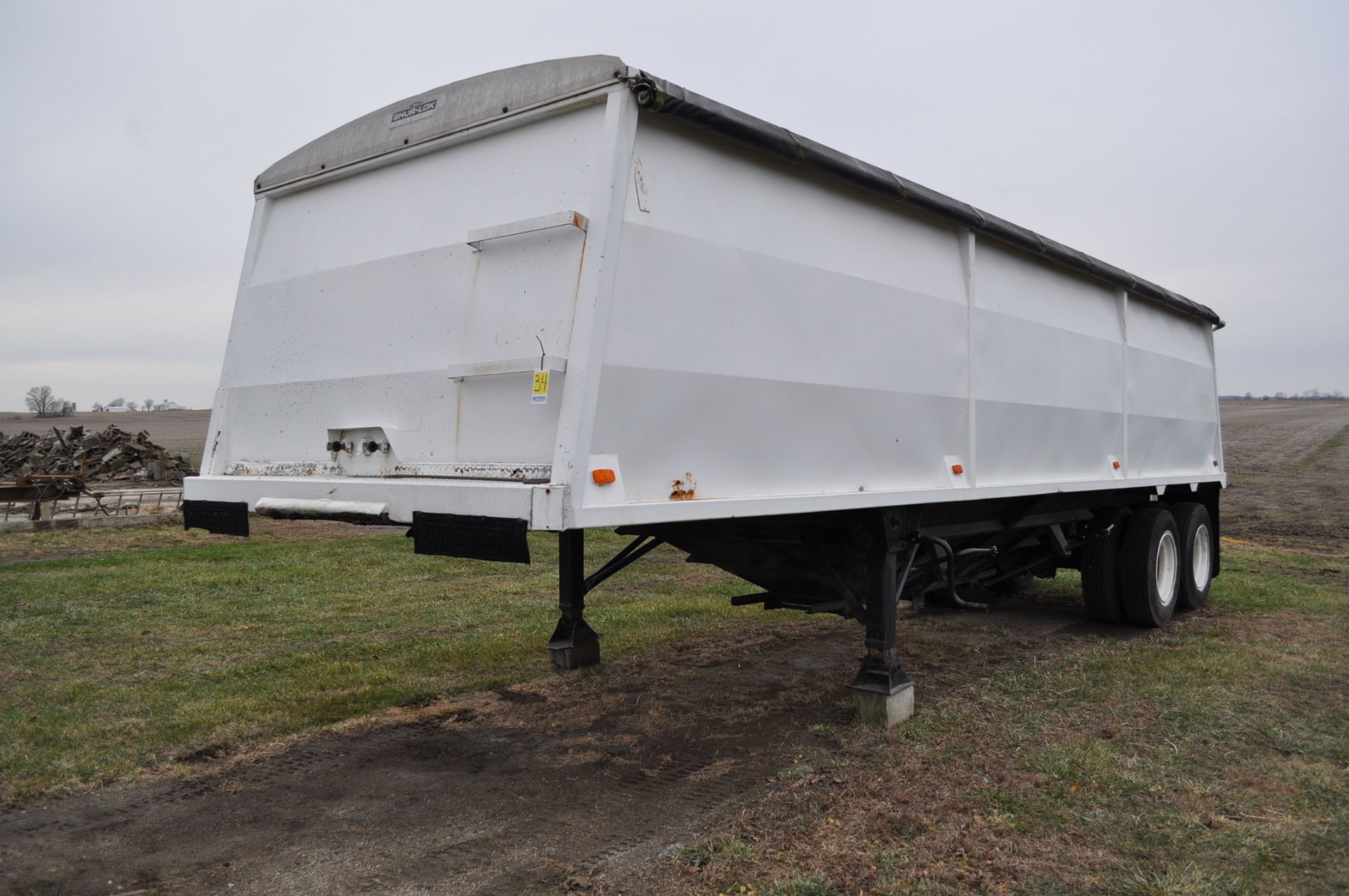 1993 30’ Wheeler steel hopper trailer, tandem axle, spring ride, roll tarp