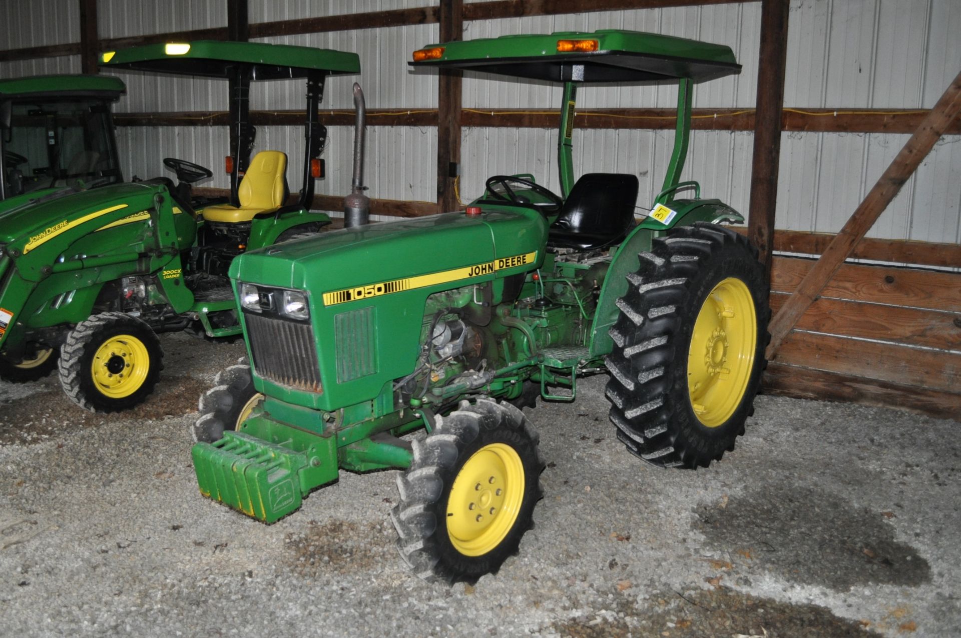 John Deere 1050 utility tractor, MFWD, 13.6-28 rear, 7-16 front bar tires, 3 pt, 540 pto, diesel