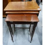 Early 20th century mahogany nest of three rectangular tables on slim turned supports with