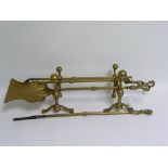 Three piece brass companion set with foliate scroll handles & a pair of brass andirons with ball