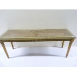 Rectangular coffee table with cane top on turned tapered reeded supports.