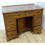 20th century mahogany writing desk in the George III style, two frieze drawers above kneehole