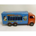 Large Tri-ang tinplate circus van in worn condition, lacking animals, 59cm long.