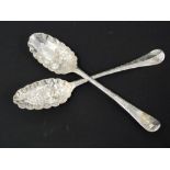 Pair of silver berry spoons, one c.1715, the other 1733.