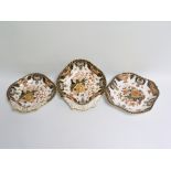 Pair of Royal Crown Derby Imari dishes of shell form, each 25cm wide & another of octagonal form,