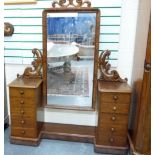 Victorian mahogany dressing table, the tall rectangular swing mirror between scrolling supports on