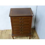 Edwardian mahogany music cabinet of six drawers with inlaid banding on short cabriole supports. 53cm