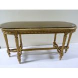 Rectangular coffee table with curved ends & caned top on reeded supports with shaped understretchers