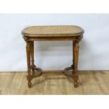 20th century cane seat dressing table stool in the French style.